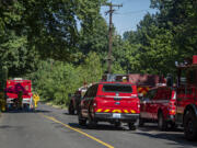 Firefighters respond to a two-alarm fire at a large house on Evergreen Highway.on Monday afternoon, June 28, 2021.