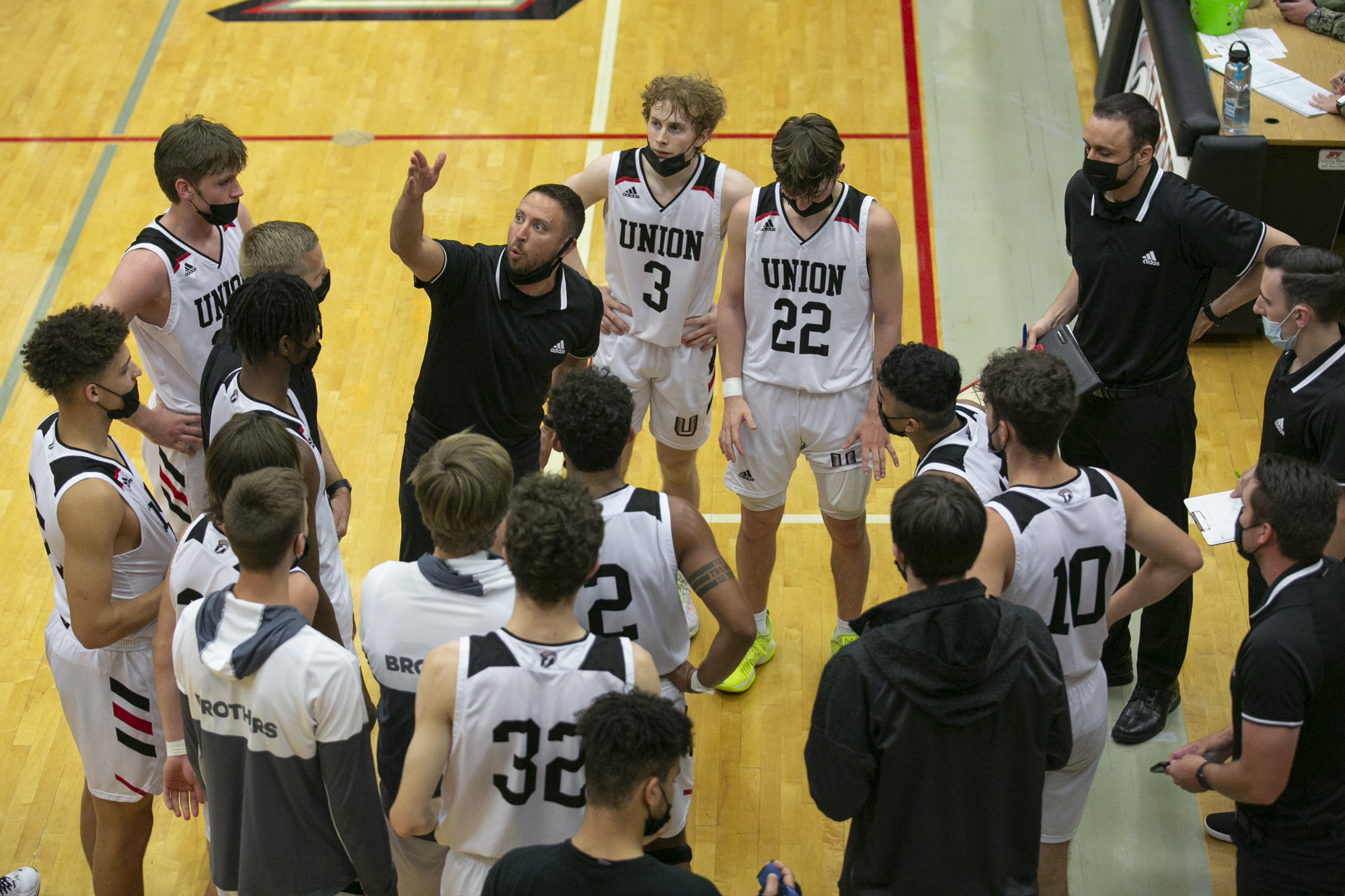 Union's head coach Blake Conley talks to his team during a timeout during the 4A/3A GSHL boys basketball playoff game at Union High School on Thursday, June 3, 2021.