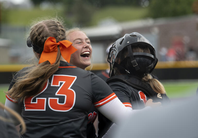 From left, Liv Gruenberg, Ryee Rehbein and Alexis Laizure hug after winning the 4A/3A Greater St. Helens League district championship game on Saturday, June 5, 2021, at Camas High School. Battle Ground defeated Mountain View 8-0 to take the title.