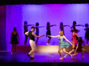 BATTLE GROUND: Prairie High School students David Hatcher and Carson Verity dance during an ensemble production.