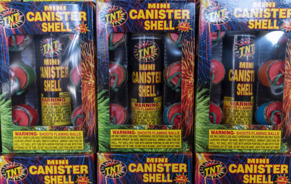 Boxes of "Mini Canister Shell" fireworks sit on shelves inside TNT Fireworks Warehouse.