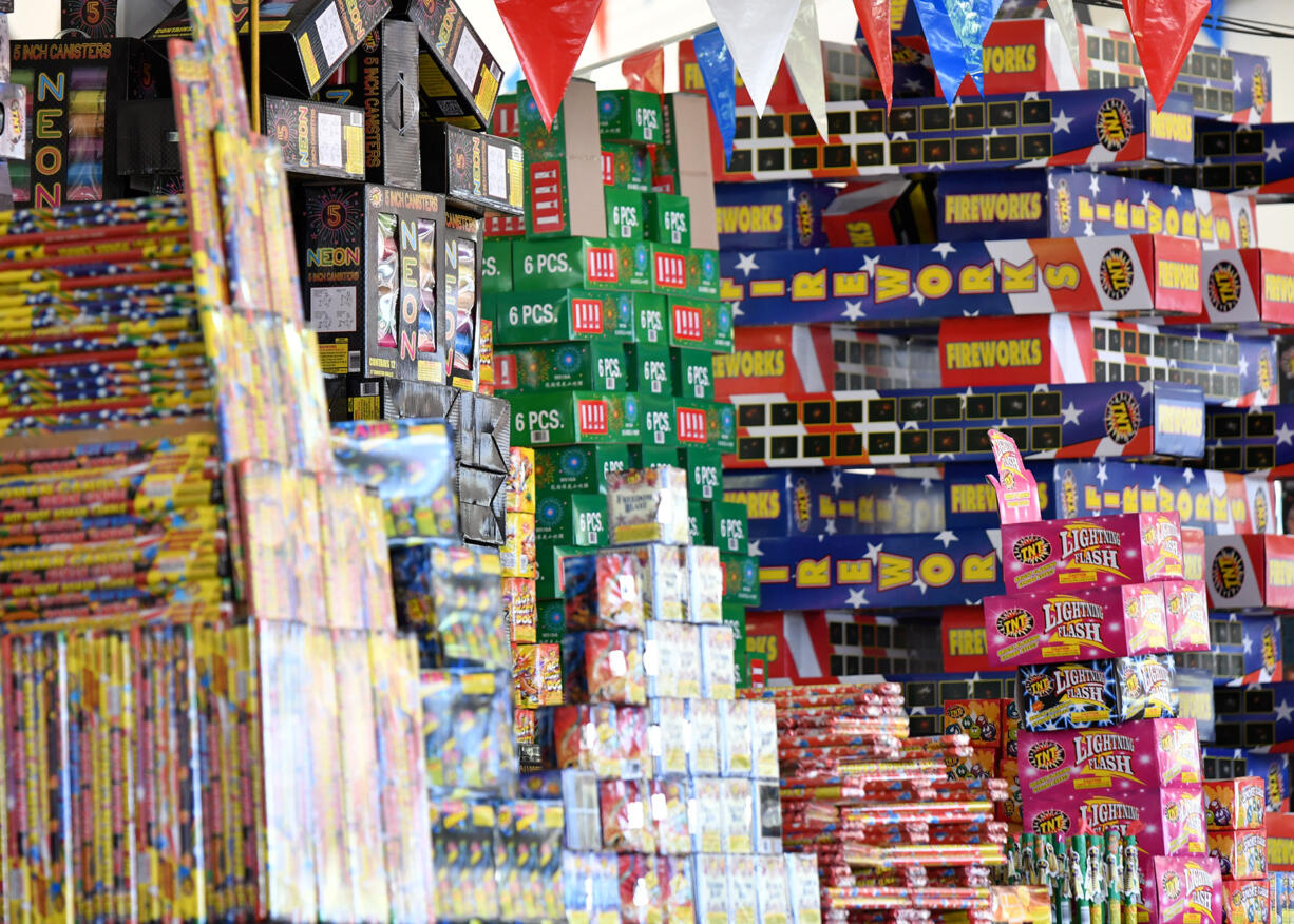 Stacks of fireworks sit atop shelves Thursday at the TNT Fireworks Warehouse in Hazel Dell. Clark County banned the use and sale of fireworks effective Tuesday.