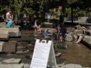 Kids play in the water on Friday, June 25, 2021, at the Esther Short Water Feature.