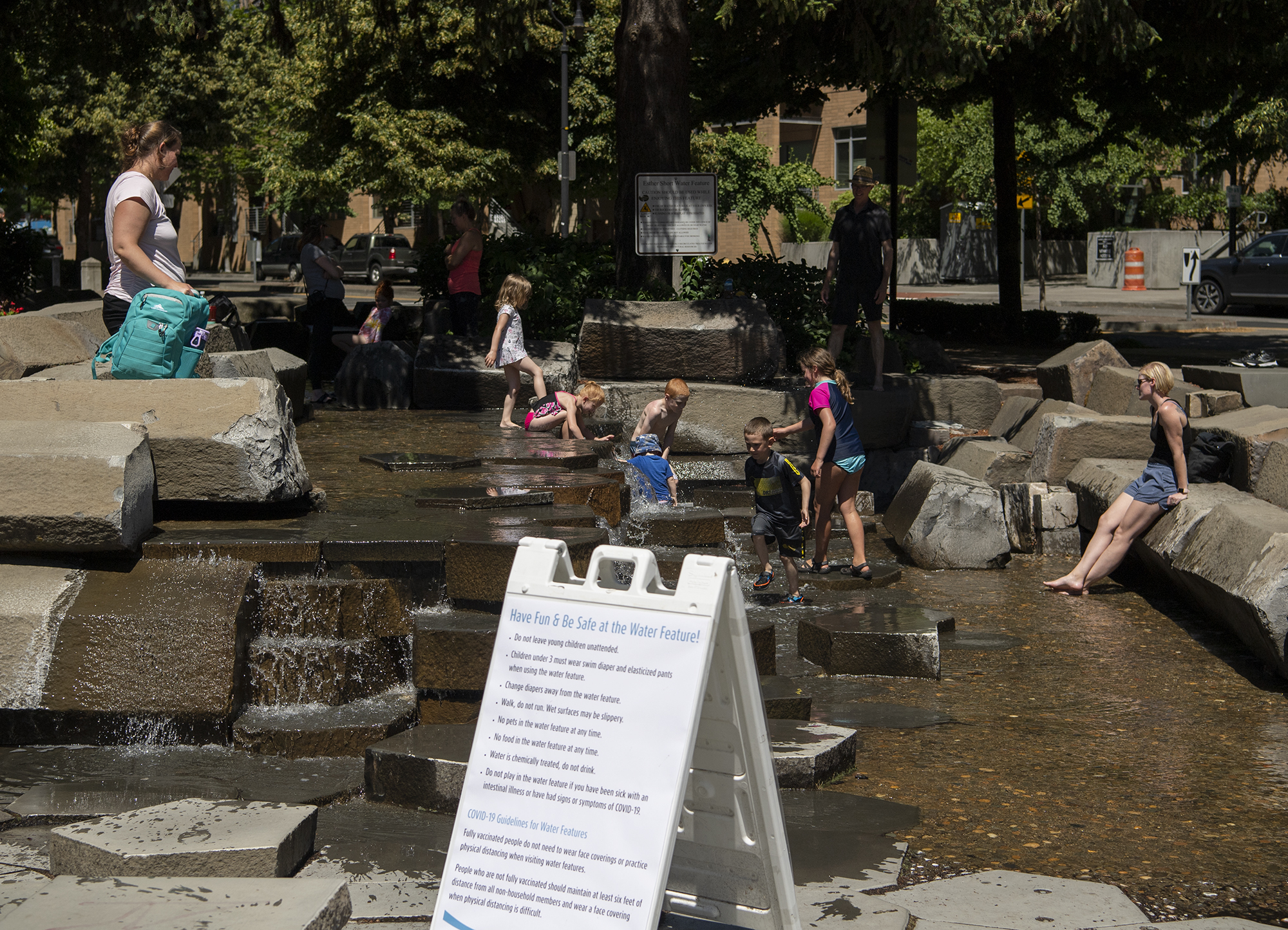 Kids play in the water on Friday, June 25, 2021, at the Esther Short Water Feature.