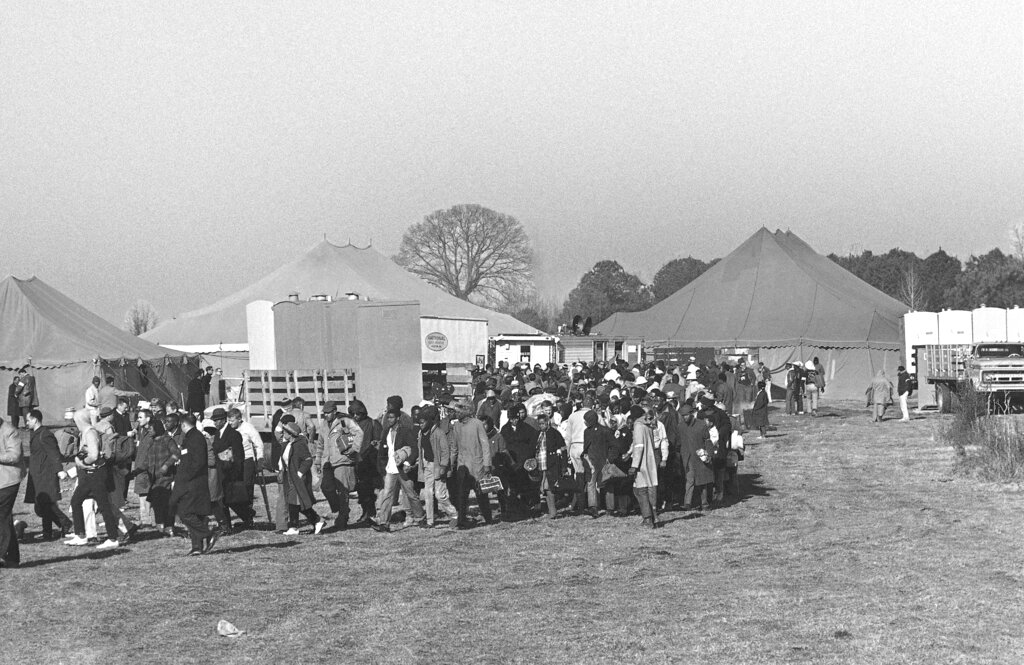 FILE - In this March 22, 1965, file photo, participants in the Selma-to-Montgomery voting rights march are shown at a campsite near Selma, Ala. A new assessment released by the National Trust for Historic Preservation in 2021 says four campsites used by marchers nearly 60 years earlier are in danger of being lost without efforts to save them.