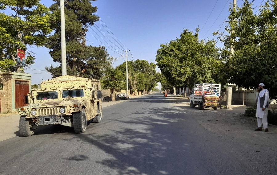 An Afghan army Humvee patrols in Kunduz city, north of Kabul, Afghanistan, Monday, June 21, 2021. Taliban fighters took control of a key district in Afghanistan's northern Kunduz province Monday and encircled Kunduz, the provincial capital, police said.