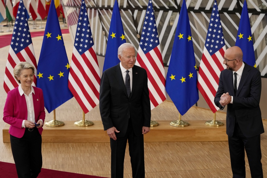 European Commission President Ursula von der Leyen, left, European Council President Charles Michel, right, and U.S. President Joe Biden speak with the media as they arrive for the EU-US summit at the European Council building in Brussels, Tuesday, June 15, 2021.