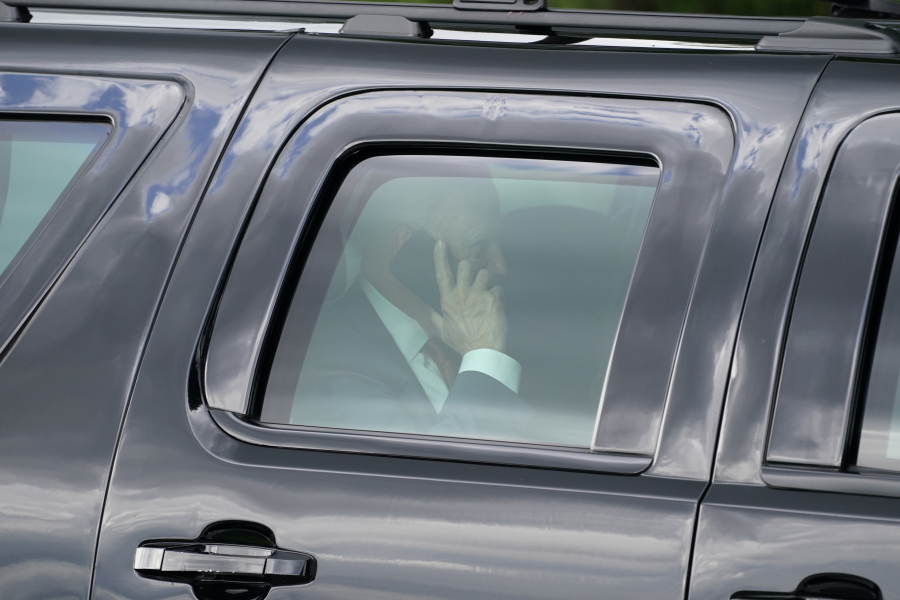President Joe Biden speaks on his phone after he and first lady Jill Biden arrived on the Ellipse near the White House, Friday, June 4, 2021, in Washington. Biden returns to the White House after spending a few days in Rehoboth Beach to celebrate first lady Jill Biden's 70th birthday.
