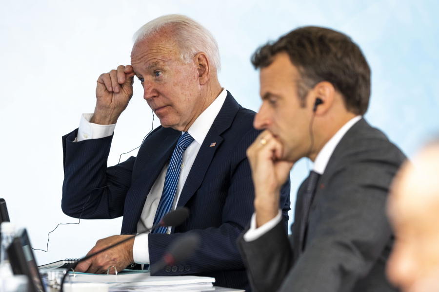 President Joe Biden talks with French President Emmanuel Macron during the final session of the G-7 summit in Carbis Bay, England, Sunday, June 13, 2021.