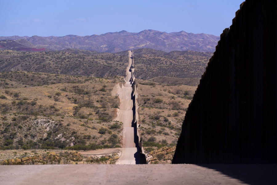 A new border wall stretches along the landscape near Sasabe, Ariz., on Wednesday, May 19, 2021. (AP Photo/Ross D.