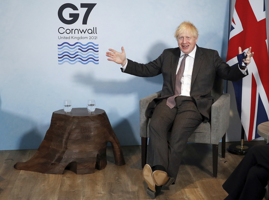 Britain's Prime Minister Boris Johnson meets with European Commission President Ursula von der Leyen and European Council President Charles Michel during the G7 summit in Cornwall, England, Saturday June 12, 2021.