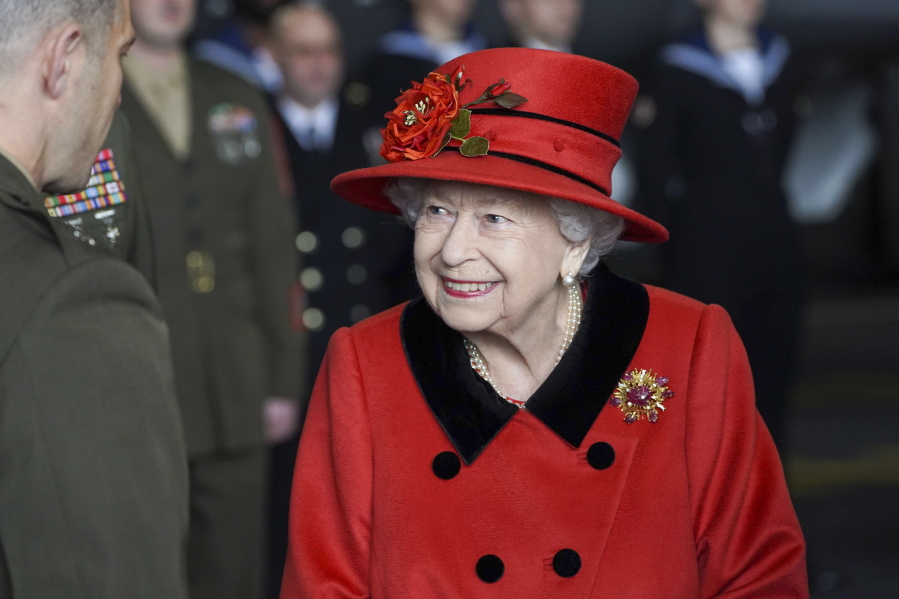 Britain's Queen Elizabeth II visits the HMS Queen Elizabeth at HM Naval Base, ahead of the ship's maiden deployment, in Portsmouth, England, Saturday May 22, 2021. HMS Queen Elizabeth will be leading a 28-week deployment to the Far East that Prime Minister Boris Johnson has insisted is not confrontational towards China.