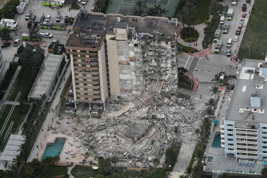 This aerial photo shows part of the 12-story oceanfront Champlain Towers South Condo that collapsed early Thursday, June 24, 2021 in Surfside, Fla.