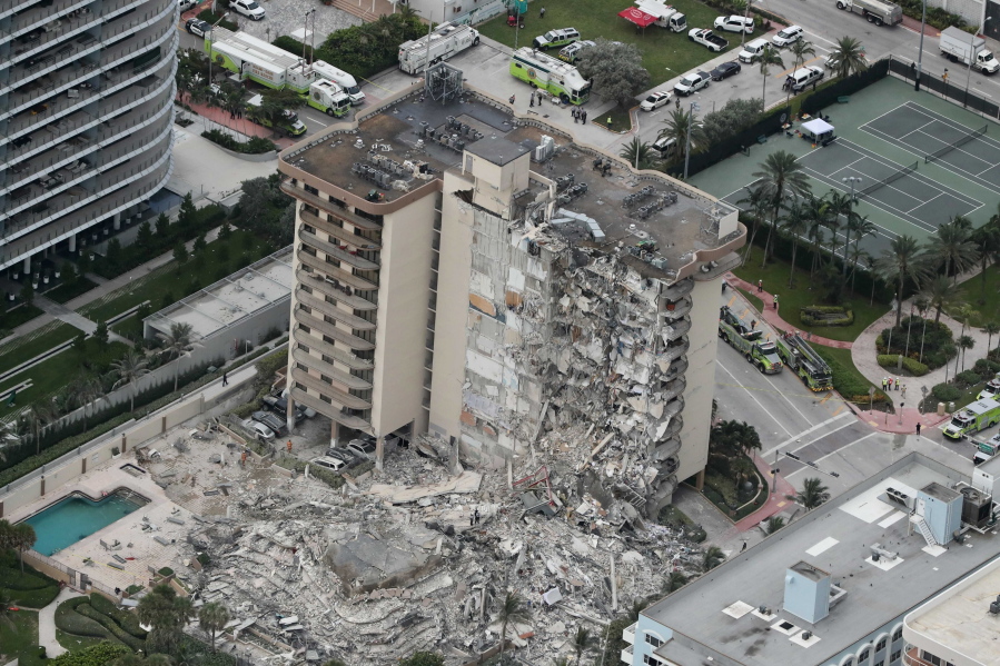 This aerial photo shows part of the 12-story oceanfront Champlain Towers South Condo that collapsed early Thursday, June 24, 2021 in Surfside, Fla.