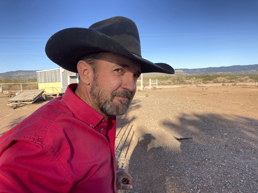 Otero County Commissioner Couy Griffin, the founder of Cowboys for Trump, takes in the view from his ranch in Tularosa, N.M., on Wednesday, May 12, 2021. Griffin is reviled and revered in politically conservative Otero County as he confronts criminal charges for joining protests on an outdoor terrace of the U.S. Capitol on Jan. 6. He's also fighting for his political future amid a recall initiative and state probes into his finances.