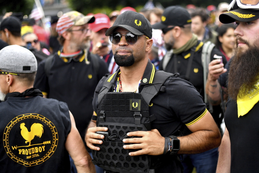 FILE - In this Aug. 17, 2019, file photo, Proud Boys chairman Enrique Tarrio rallies in Portland, Ore. Outside pressures and internal strife are roiling two far-right extremist groups after members were charged in the attack on the U.S. Capitol. Former President Donald Trump's lies about a stolen 2020 election united an array of right-wing supporters, conspiracy theorists and militants on Jan. 6.