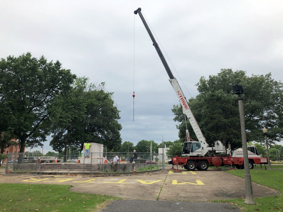 A heavy crane that will be used to help dig up the remains of former Confederate Gen. Nathan Bedford Forrest sits at a park on Tuesday, June 1, 2021, in Memphis, Tenn. The bodies of Forrest and his wife are being moved from the Memphis park, where they have been buried for decades, to a museum in Middle Tennessee.
