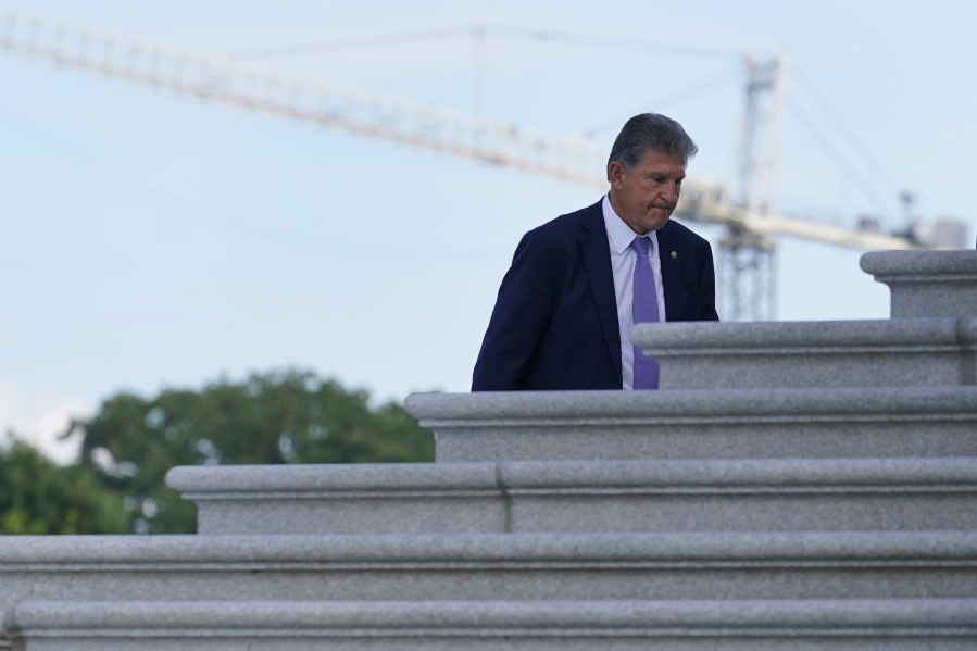Sen. Joe Manchin, D-W.Va., walks up the steps of Capitol Hill in Washington, Monday, June 7, 2021.