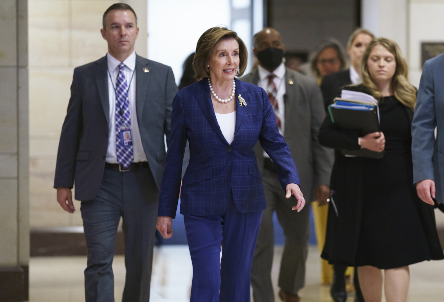 House Speaker Nancy Pelosi, D-Calif., arrives Tuesday to meet with the House Democratic Caucus and Biden administration officials to discuss progress on an infrastructure bill, at the Capitol in Washington. (J.