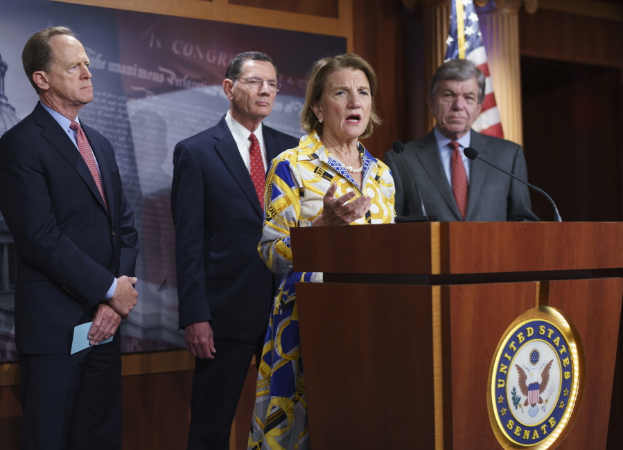 In this photo taken Thursday, May 27, 2021, Sen. Shelley Moore Capito, R-W.Va., the GOP's lead negotiator on a counteroffer to President Joe Biden's infrastructure plan, speaks at a news conference as she is joined by, from left, Sen. Pat Toomey, R-Pa., Sen. John Barrasso, R-Wyo., chairman of the Senate Republican Conference, and Sen. Roy Blunt, R-Mo., at the Capitol in Washington. Biden and the West Virginia senator will meet Wednesday afternoon to work on their differences. (AP Photo/J.