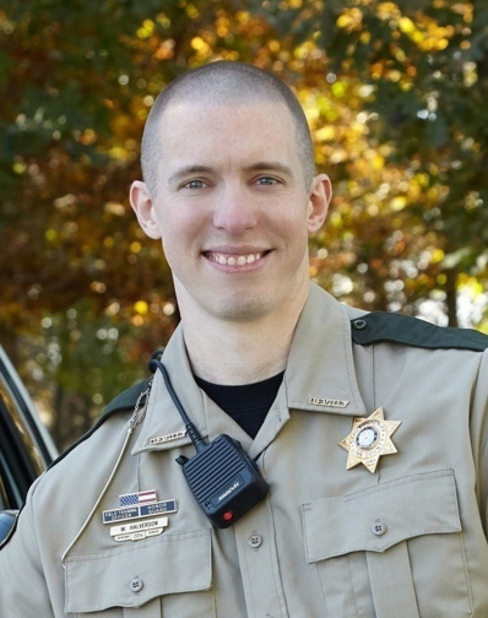 This photo provided by Linn County, Iowa sheriff's office shows deputy William Halverson.  A criminal complaint released Tuesday, June 22, 2021,  says Linn County Deputy William Halverson was wearing a protective vest but was shot by Stanley Donahue in the left hip and leg while responding to a robbery Sunday night at the Casey's General Store in Coggon, Iowa.