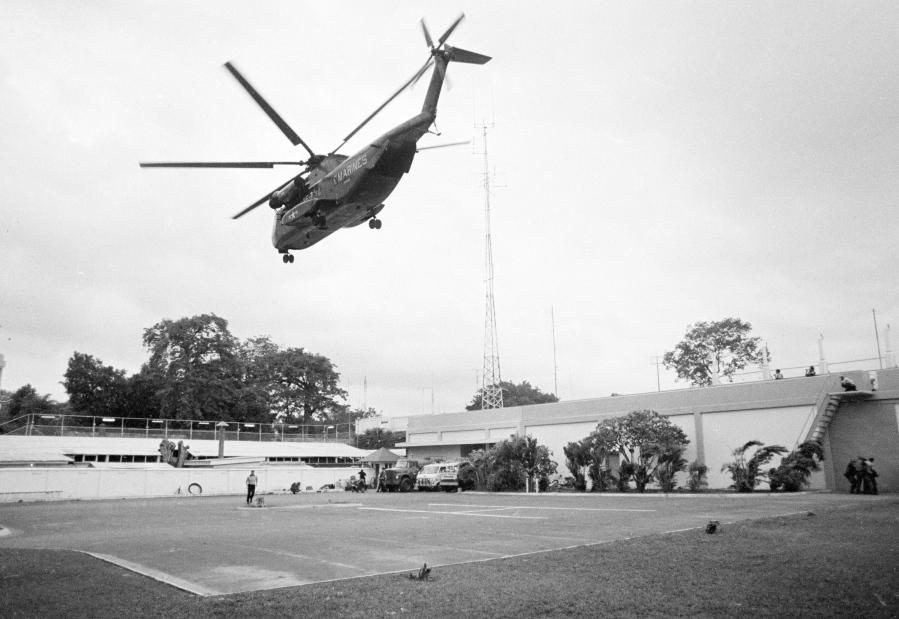 FILE - In this April 29, 1975, file photo the helicopter zone at the U.S. Embassy in Saigon, Vietnam, showing last minute evacuation of authorized personnel and civilians. With U.S. and NATO forces under a Sept. 11, 2021, deadline to leave Afghanistan, many are recalling that desperate, hasty exodus as they urge the Biden administration to evacuate thousands of Afghans who worked as interpreters or otherwise helped U.S. military operations there in the past two decades.