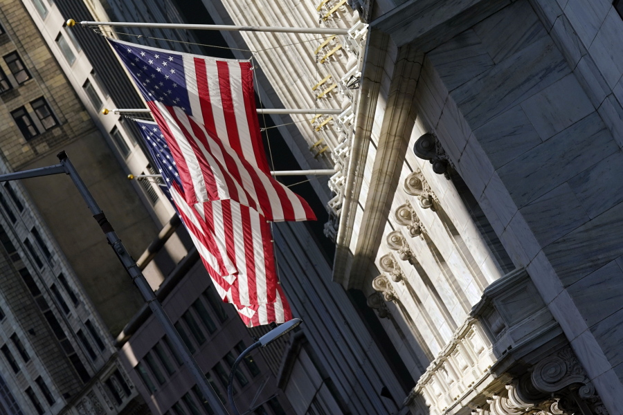 U.S. flags fly from the facade of the New York Stock Exchange, Monday, June 7, 2021. Stocks are opening mostly higher on Wall Street as gains for Big Tech companies offset weakness in banks and other parts of the market. The S&P 500 edged up 0.1 percent in the early going Wednesday, June 9.