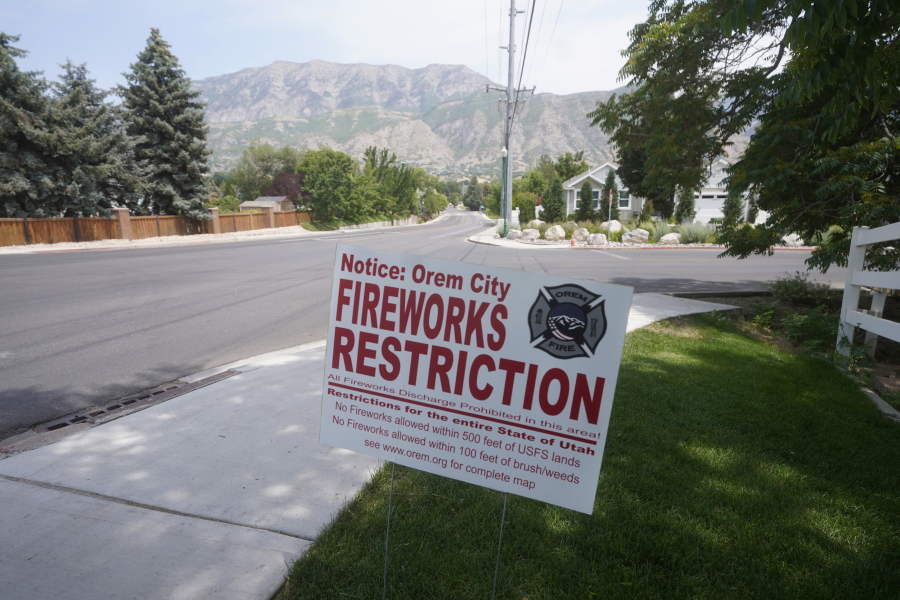 A "Orem City Fireworks Restriction" sign is shown on Tuesday, June 22, 2021, in Orem, Utah. Many Americans aching for normalcy as pandemic restrictions end are looking forward to traditional Fourth of July fireworks. But with a historic drought in the U.S. West and fears of another devastating wildfire season, officials are canceling displays, passing bans or begging for caution.