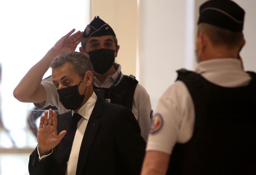 Former French President Nicolas Sarkozy arrives at the court room in Paris, Tuesday, June 15, 2021. Nicolas Sarkozy goes trial on charges that his unsuccessful reelection bid was illegally financed.