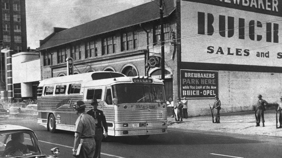 FILE - In this May 15, 1961 file photo, a bus bearing Freedom Riders leaves the station as they resumed their rides through the South in Montgomery, Ala.  Jimmy Allen Ruth, the Trailways bus driver for the 1961 group of Nashville Freedom Riders, has died, his family said Saturday, June 5, 2021.   The Freedom Rides Movement of 1961 started in Washington, D.C. by 13 men and women who traveled to the South by bus and train to force desegregation of interstate transportation facilities.