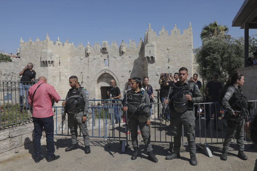 Israeli border police stand guard next to the Damascus gate outside Jerusalem's Old City, ahead of a planned march by Jewish ultranationalists through east Jerusalem, Tuesday, June 15, 2021.