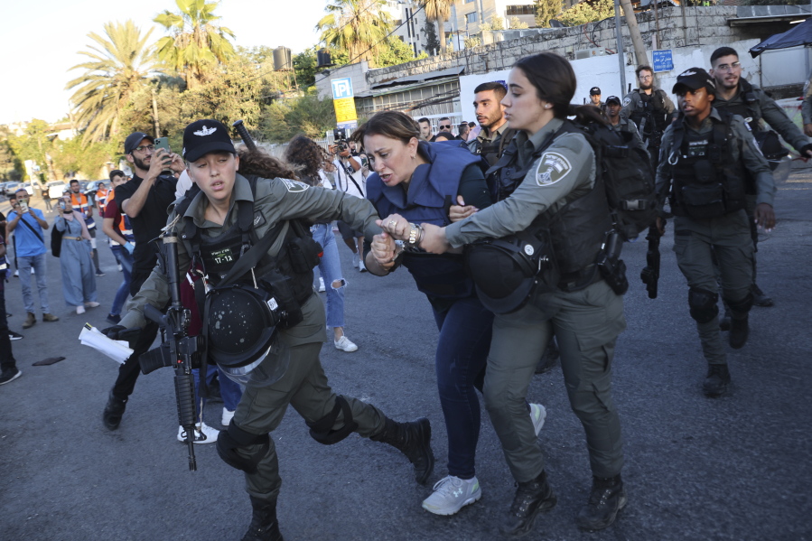Israeli forces arrest Al Jazeera journalist, Givara Budeiri, during a protest in the east Jerusalem neighborhood of Sheikh Jarrah, Saturday, June 5, 2021.