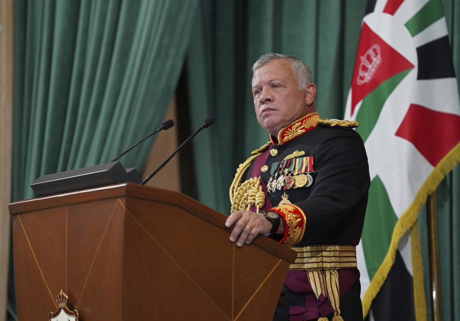 FILE - In this Dec. 10, 2020 file photo released by the Royal Hashemite Court, Jordan's King Abdullah II gives a speech to parliament, in Amman Jordan. Jordan's version of a trial of the century gets under way as early as Monday, June 21, 2021. A relative of King Abdullah II and a former chief of the royal court will be ushered into the defendants' cage at the state security court to face sedition charges. They are accused of conspiring with Prince Hamzah, a half-brother of the king, to foment unrest against the monarch.