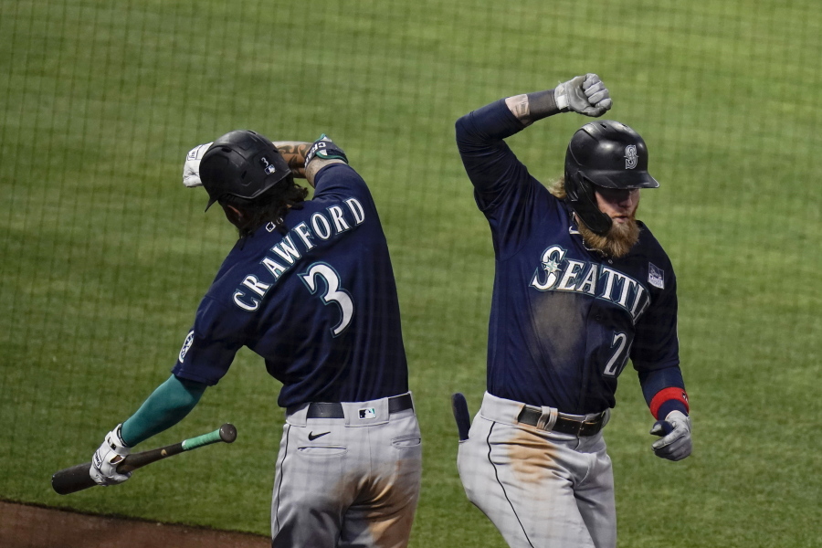 Seattle's Jake Fraley, right, celebrates his three-run home run with J.P. Crawford during the fourth inning.