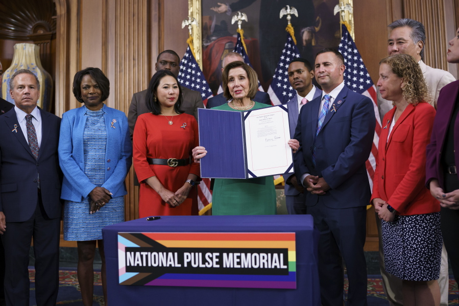 House Speaker Nancy Pelosi, D-Calif., is joined by members after signing a bill to create the National Pulse Memorial to honor the victims of the 2016 mass shooting at the Pulse nightclub in Orlando, at the Capitol in Washington, Wednesday, June 16, 2021. From left are Rep. David Cicilline, D-R.I., Rep. Val Demings, D-Fla., Rep. Stephanie Murphy, D-Fla., Speaker Pelosi, Rep. Darren Soto, D-Fla., and Rep. Debbie Wasserman Schultz, D-Fla. It was the deadliest attack on the LGBTQ community in U.S. history, 49 people dead. (AP Photo/J.