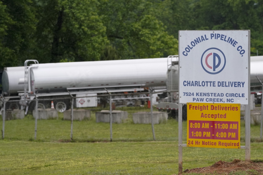 Tanker trucks are parked near the entrance of Colonial Pipeline Company Wednesday, May 12, 2021, in Charlotte, N.C.  The operator of the nation's largest fuel pipeline has confirmed it paid $4.4 million to a gang of hackers who broke into its computer systems. That's according to a report from the Wall Street Journal. Colonial Pipeline's CEO Joseph Blount told the Journal that he authorized the payment after the ransomware attack because the company didn't know the extent of the damage.