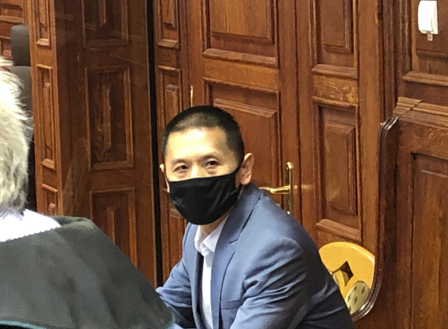Chinese citizen and former director at Huawei in Poland, Weijing Wang, at the opening of his trial on charges of spying for China at a court in Warsaw, Poland, on Tuesday, June 1, 2021. Wang has pleaded not guilty.