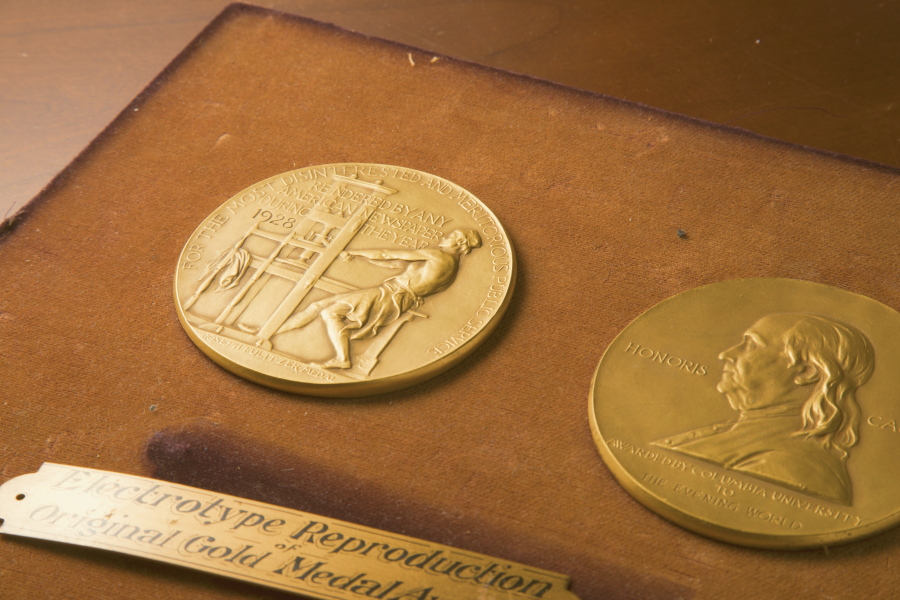 This undated photo shows the front and back sides of the medal awarded for the Pulitzer Prizes in New York.  The Pulitzer Prizes in journalism and the arts will be announced, Friday, June 11, 2021,  almost two months later than initially planned due to the pandemic.