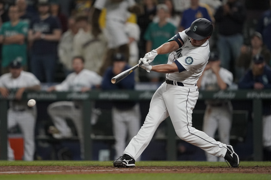 Seattle Mariners' Kyle Seager hits a single to drive in the winning run in the ninth inning of the team's baseball game against the Tampa Bay Rays, Thursday, June 17, 2021, in Seattle. The Mariners won 6-5. (AP Photo/Ted S.