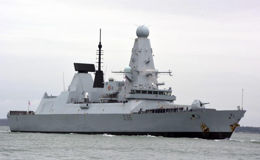 FILE - This March 20, 2020 file photo shows HMS Defender in Portsmouth, England. The Russian military says its warship has fired warning shots and a warplane dropped bombs to force the British destroyer from Russia's waters near Crimea in the Black Sea. The incident on Wednesday June 23, 2021, marks the first time since the Cold War era when Moscow used live ammunition to deter a NATO warship, reflecting soaring Russia-West tensions.