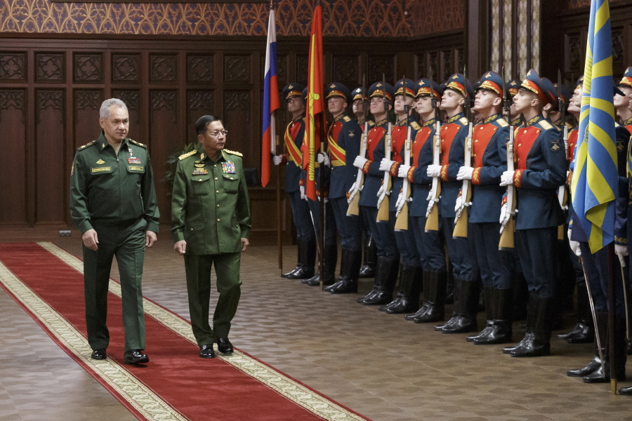Russian Defense Minister Sergei Shoigu, left, and Commander-in-Chief of Myanmar's armed forces, Senior General Min Aung Hlaing walk past the honor guard prior to their talks in Moscow, Russia, Tuesday, June 22, 2021.