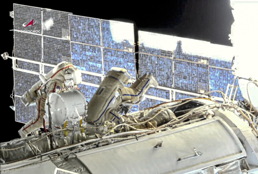 In this image taken from Roscosmos video, Russian cosmonauts Oleg Novitsky, left, and Pyotr Dubrov, members of the crew to the International Space Station (ISS), perform their first spacewalk on Wednesday, June 2, 2021, to replace old batteries outside the International Space Station. Two Russian members of the International Space Station crew are conducting a spacewalk. Oleg Novitskiy and Pyotr Dubrov are scheduled to conduct technical works before the arrival of a new Russian module. The duo is set to prepare for undocking and disposal of the Pirs docking compartment, which will be replaced later this year by the new Nauka (Science) multipurpose laboratory module.