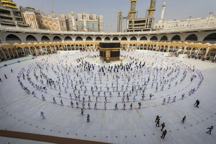 FILE - In this July 31, 2020, file photo, pilgrims walk around the Kabba at the Grand Mosque in the Muslim holy city of Mecca, Saudi Arabia. Saudi Arabia said Saturday, July 12, 2021, that this year's hajj pilgrimage will be limited to no more than 60,000 people, all of them from within the kingdom, due to the ongoing coronavirus pandemic.