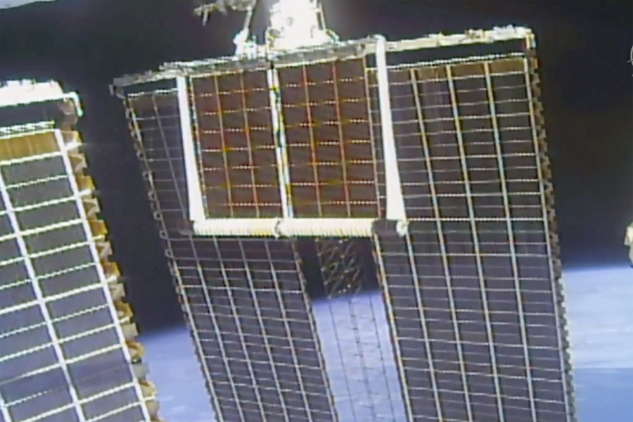 In this image taken from NASA video, a solar panel is unfolded at the International Space Station, Sunday, June 20 2021.