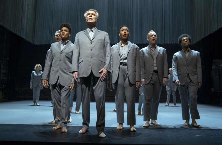 This image released by HBO shows David Byrne, foreground, in a scene from "David Byrne's American Utopia." The American Theatre Wing and the Broadway League announced Tuesday that "David Byrne's American Utopia" will receive a Special Tony Award, (HBO via AP)