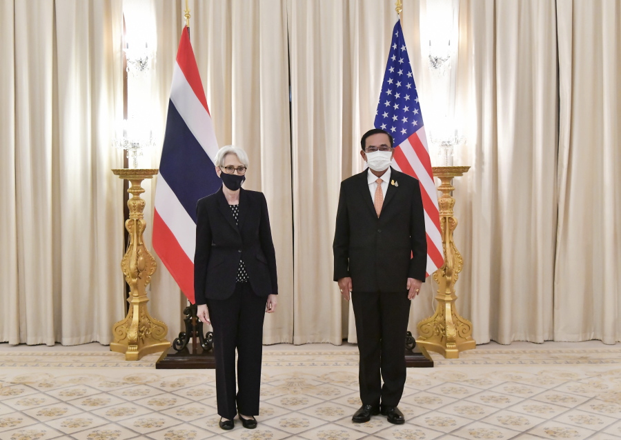 In this photo released by Government Spokesman Office, U.S. Deputy Secretary of State Wendy R. Sherman, left, and Thailand's Prime Minister Prayuth Chan-ocha, right, pose for photo, at Government House in Bangkok, Thailand, Wednesday, June 2, 2021.