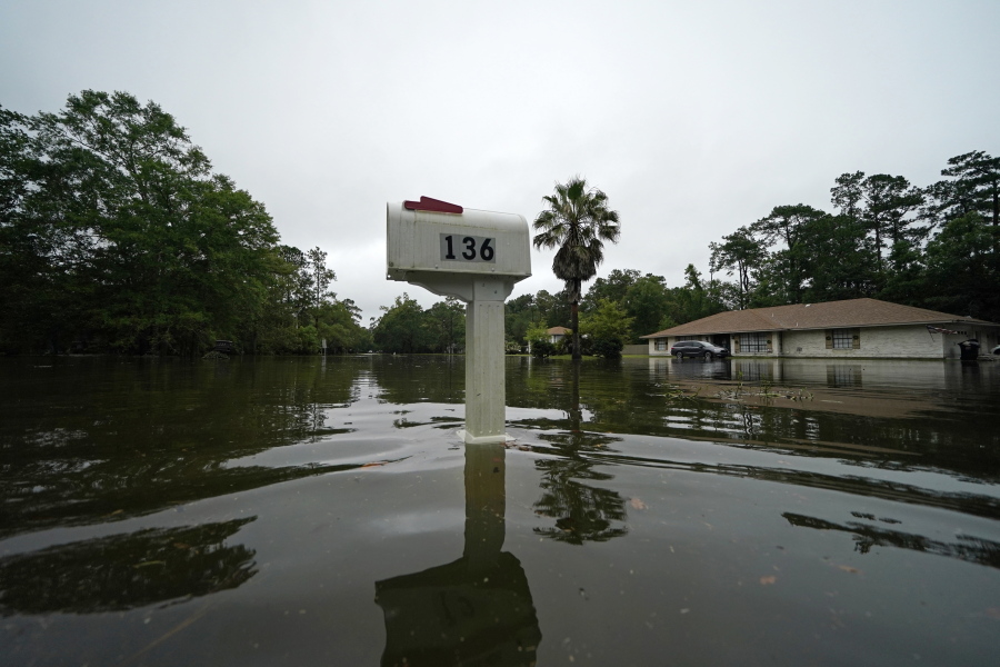 A flooded neighborhood is seen after Tropical Storm Claudette passed through in Slidell, La., Saturday, June 19, 2021.   The National Hurricane Center declared Claudette organized enough to qualify as a named storm early Saturday, well after the storm's center of circulation had come ashore southwest of New Orleans.