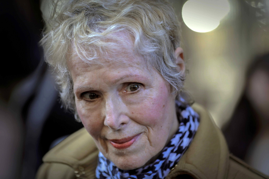 FILE - In this March 4, 2020, file photo, E. Jean Carroll talks to reporters outside a courthouse in New York. On Monday, June 7, 2021, Justice Department lawyers said former President Donald Trump cannot be held personally liable for "crude and disrespectful" remarks he made while president about Carroll, who accused him of rape.