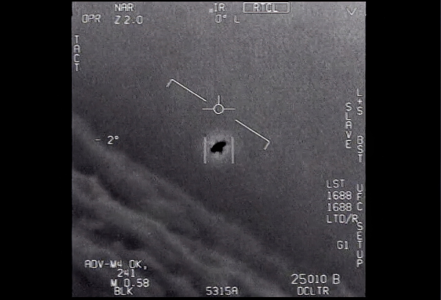 The image from video provided by the Department of Defense labelled Gimbal, from 2015, an unexplained object is seen at center as it is tracked as it soars high along the clouds, traveling against the wind. "There's a whole fleet of them," one naval aviator tells another, though only one indistinct object is shown. "It's rotating." The U.S. government has been taking a hard look at unidentified flying objects, under orders from Congress, and a report summarizing what officials know is expected to come out in June 2021.