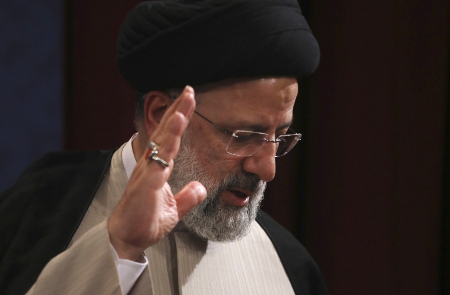 In this June 21, 2021, photo, Iran's new President-elect Ebrahim Raisi waves at the conclusion of his news conference in Tehran, Iran. Biden administration officials are insisting that the election of a hard-liner as Iran's president won't affect prospects for reviving the faltering 2015 nuclear deal with Tehran. But there are already signs that their goal of locking in a deal just got harder.